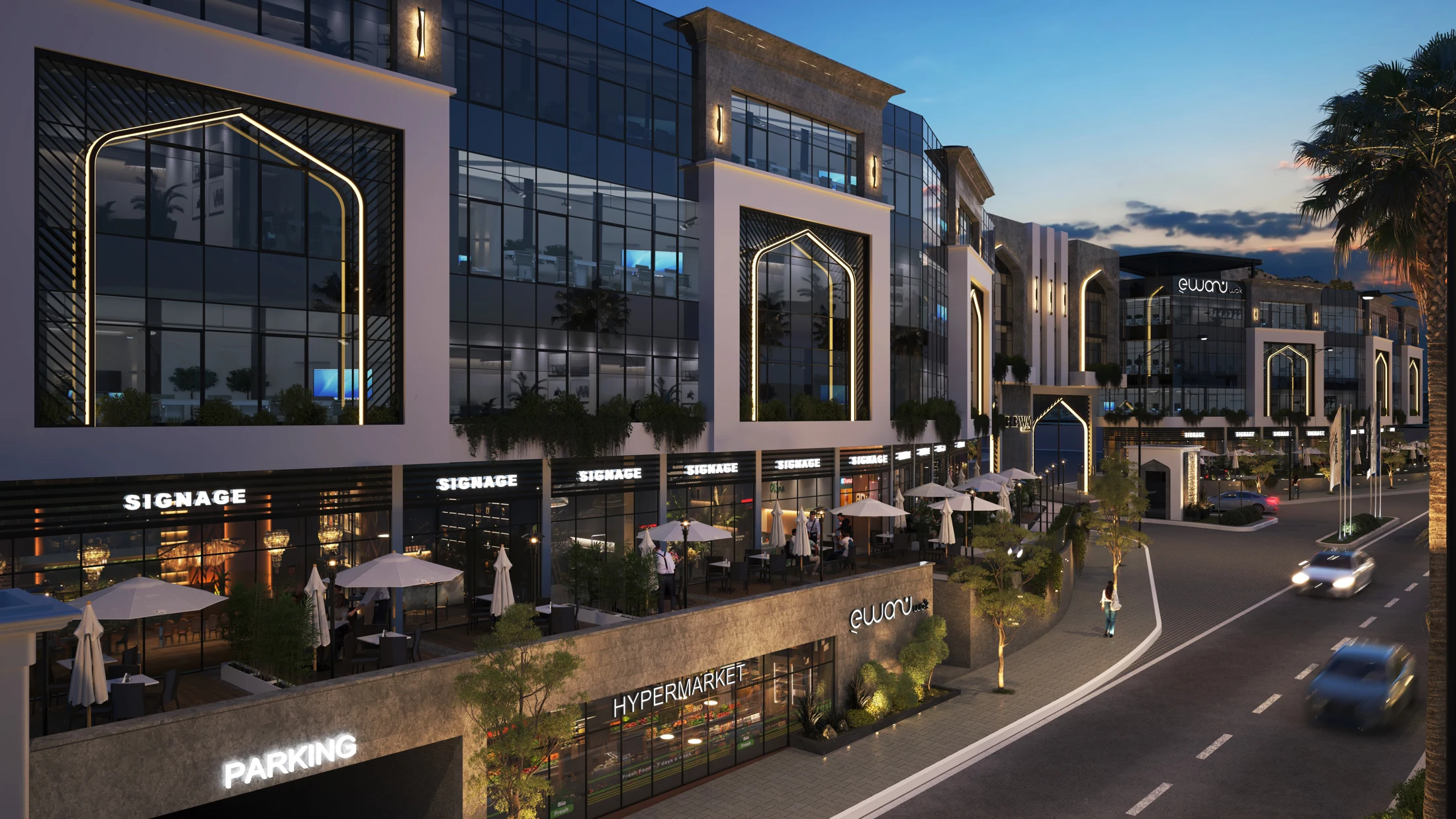 Ewan Walk retail frontage and illuminated arches at dusk